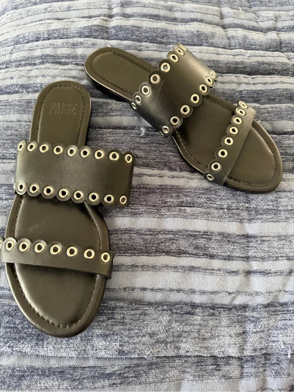 Paige Black Leather and Grommet Flat Sandals in size 7.5